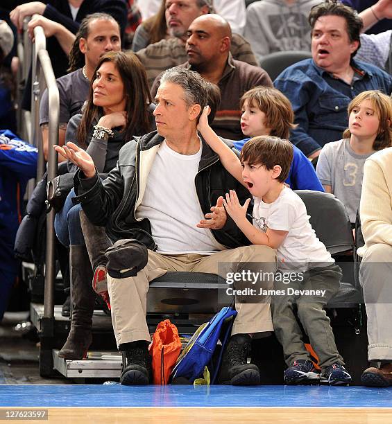 Jon Stewart and son Nathan Thomas Stewart attend the Cleveland Cavaliers vs New York Knicks game at Madison Square Garden on March 4, 2011 in New...