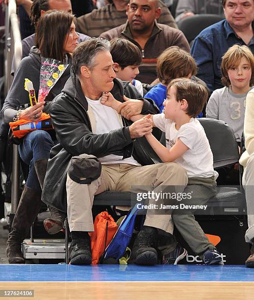 Jon Stewart and son Nathan Thomas Stewart attend the Cleveland Cavaliers vs New York Knicks game at Madison Square Garden on March 4, 2011 in New...