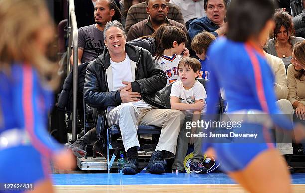 Jon Stewart and son Nathan Thomas Stewart attend the Cleveland Cavaliers vs New York Knicks game at Madison Square Garden on March 4, 2011 in New...