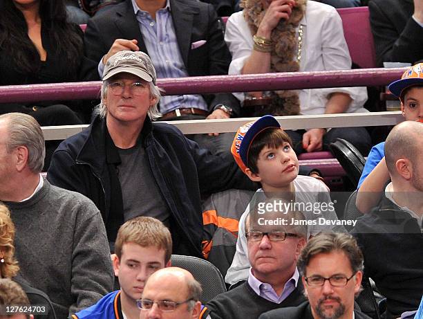 Richard Gere and son, Homer James Jigme Gere attend the Utah Jazz vs New York Knicks game at Madison Square Garden on March 7, 2011 in New York City.