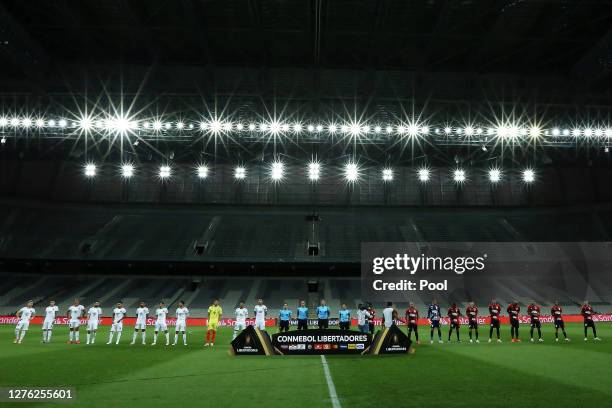 Players of Athletico Paranaense and of Colo-Colo observe a minute of silence in honor to victims of COVID-19 before their group C match of Copa...