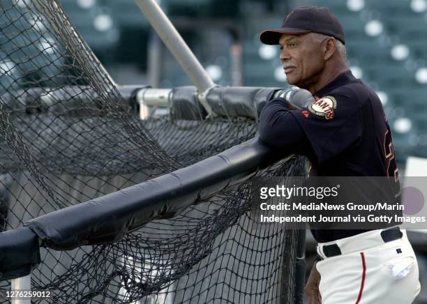 San Francisco Giants manager Felipe Alou watches from the back of the batting cage as his team practices prior to the Giants home-opening exhibition...