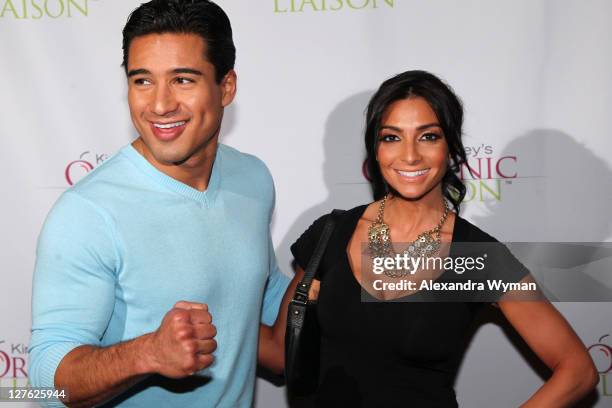 Mario Lopez and wife Courtney Mazza arrive at Kirstie Alley's Organic Liaison Store Grand Opening on March 9, 2011 in Los Angeles, California.