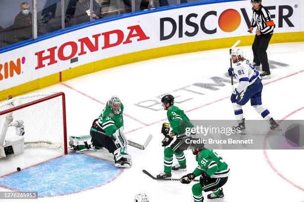 Steven Stamkos of the Tampa Bay Lightning scores a goal against Anton Khudobin of the Dallas Stars during the first period in Game Three of the 2020...