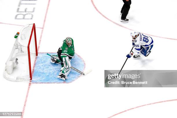 Nikita Kucherov of the Tampa Bay Lightning scores a goal past Anton Khudobin of the Dallas Stars during the first period in Game Three of the 2020...