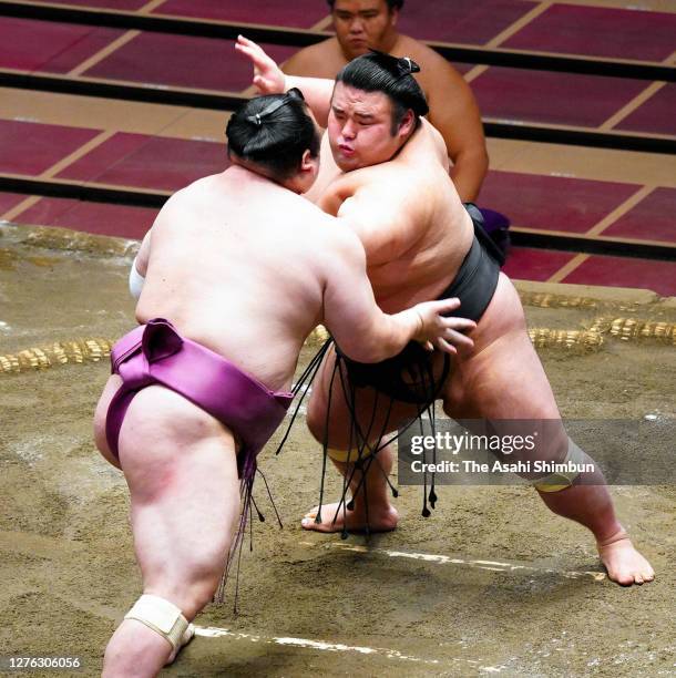 Ozeki Takakeisho pushes Takarafuji out of the ring to win on day eleven of the Grand Sumo Autumn Tournament at Ryogoku Kokugikan on September 23,...