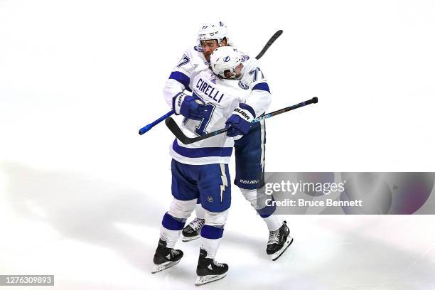 Victor Hedman of the Tampa Bay Lightning is congratulated by Anthony Cirelli after scoring a goal against the Dallas Stars during the second period...