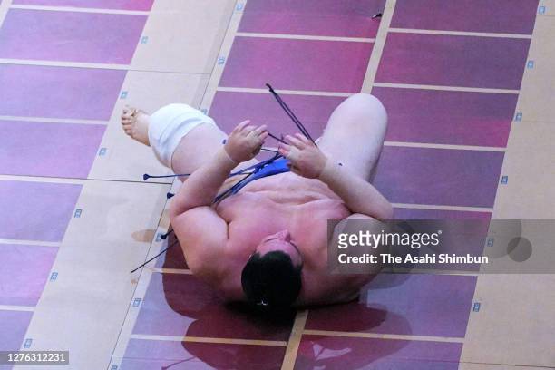 Aoiyama reacts after his defeat by Kotoshoho on day eleven of the Grand Sumo Autumn Tournament at Ryogoku Kokugikan on September 23, 2020 in Tokyo,...