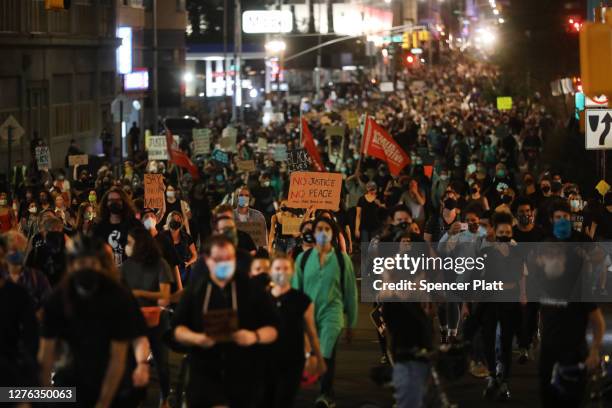 Members of Black Lives Matters are joined by hundreds of others during an evening protest against the Kentucky grand jury decision in the Breonna...