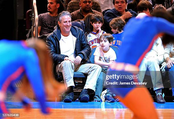 Jon Stewart and son Nathan Thomas Stewart attend the Cleveland Cavaliers vs New York Knicks game at Madison Square Garden on March 4, 2011 in New...