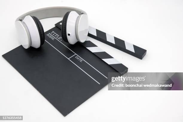 movie clapper board with headphones - storyboard cinema stock pictures, royalty-free photos & images