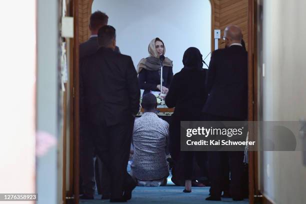 New Zealand Prime Minister Jacinda Ardern speaks to members of the Muslim community before she unveils a plaque at Al Noor Mosque on September 24,...