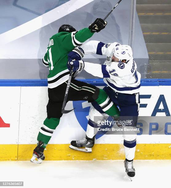 Barclay Goodrow of the Tampa Bay Lightning checks Andrew Cogliano of the Dallas Stars in Game Three of the 2020 NHL Stanley Cup Final at Rogers Place...