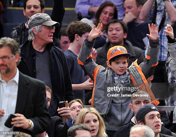 Richard Gere and son Homer James Jigme Gere attend the Utah Jazz vs New York Knicks game at Madison Square Garden on March 7, 2011 in New York City.