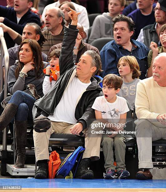 Jon Stewart and son Nathan Thomas Stewart attend the Cleveland Cavaliers vs New York Knicks game at Madison Square Garden on March 4, 2011 in New...