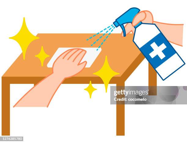 cleaning table with disinfectant spray. - clean desk wipes stock illustrations