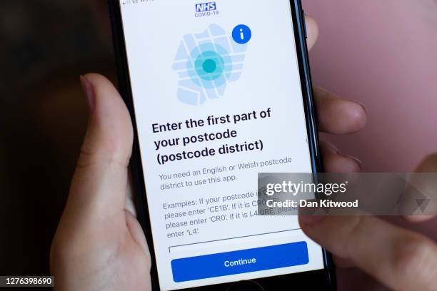 In this photo illustration, the UK governments new test and trace application is displayed on a handheld device, on September 24, 2020 in London,...