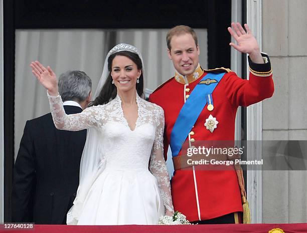 Catherine, Duchess of Cambridge and Prince William, Duke of Cambridge greet well-wishers from the balcony at Buckingham Palace on April 29, 2011 in...