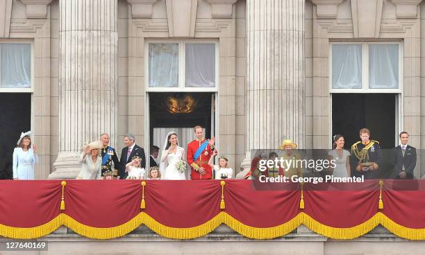 Prince William, Duke of Cambridge and Catherine, Duchess of Cambridge greet well-wishers next to members of their family on the balcony at Buckingham...
