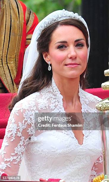 Catherine, Duchess of Cambridge travels to Buckingham Palace in the 1902 State Landau with husband Prince William, Duke of Cambridge after their...