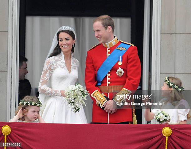 Prince William, Duke of Cambridge and Catherine, Duchess of Cambridge greet wellwishers from the balcony next to Grace Van Cutsem and Margarita...