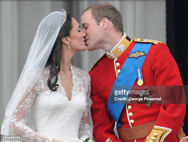 Catherine, Duchess of Cambridge and Prince William, Duke of Cambridge kiss on the balcony at Buckingham Palace on April 29, 2011 in London, England.
