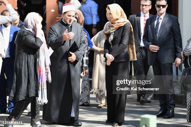 Imam Gamal Fouda of Al Noor Mosque and New Zealand Prime Minister Jacinda Ardern look on before they unveil a plaque at Al Noor Mosque on September...