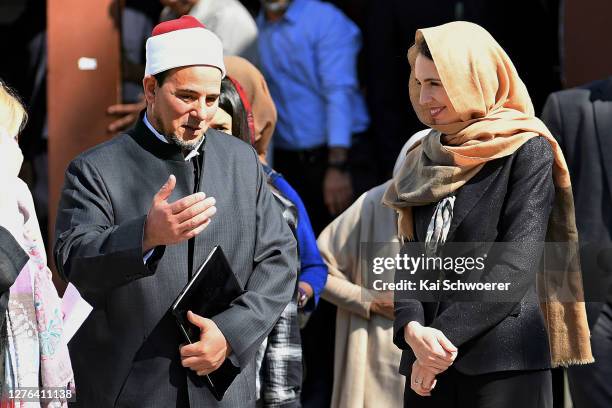 Imam Gamal Fouda of Al Noor Mosque and New Zealand Prime Minister Jacinda Ardern look on before they unveil a plaque at Al Noor Mosque on September...