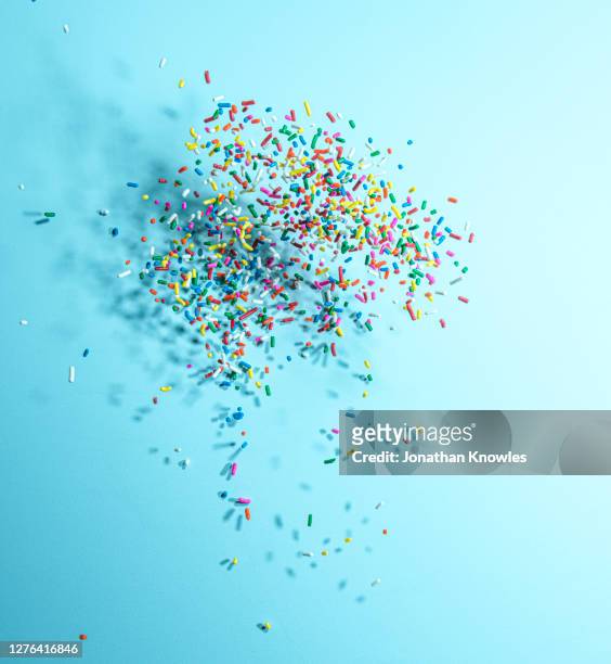 rainbow candy sprinkles - rainbow confetti stock pictures, royalty-free photos & images