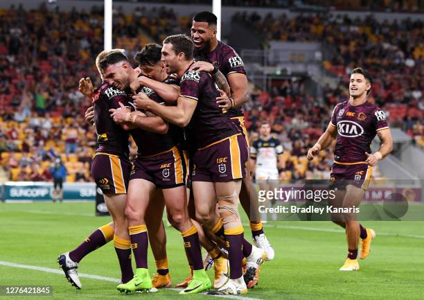 Darius Boyd of the Broncos celebrates scoring a try during the round 20 NRL match between the Brisbane Broncos and the North Queensland Cowboys at...