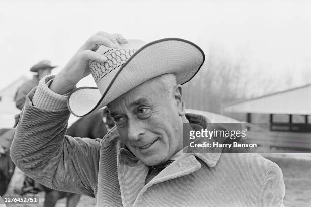 Lord Louis Mountbatten tries on a straw cowboy hat during a visit to Canada, April 1966.