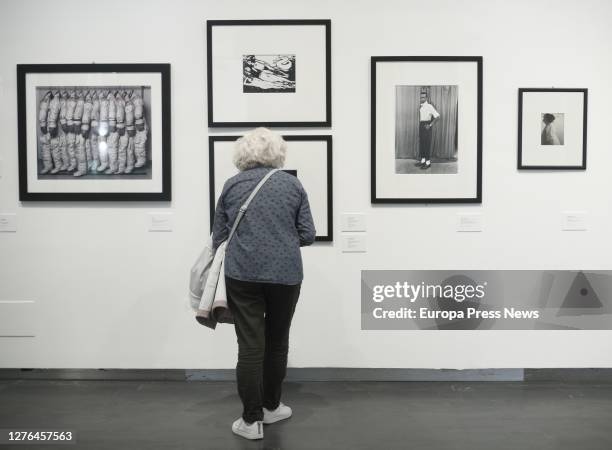 Visitor looks at one of the photographs in the exhibition 'Entre el arte y la moda. Fotografías de la colección de Carla Sozzani' in the CentroCentro...