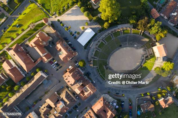 aerial view of the avanches old town and its roman amphitehatre in canton vaud, switzerland - avenches location stock pictures, royalty-free photos & images