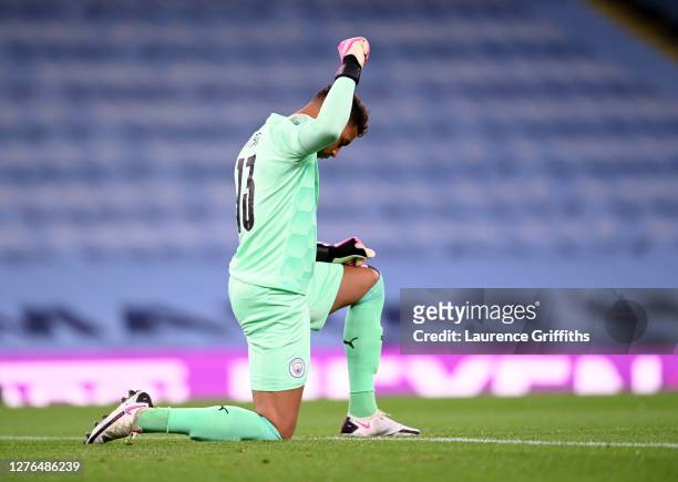 Zack Steffen of Manchester City takes a knee in support of the Black Lives Matter Movement prior to the Carabao Cup third round match between...
