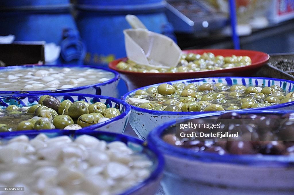 Olives in blue and white ceramic bowls