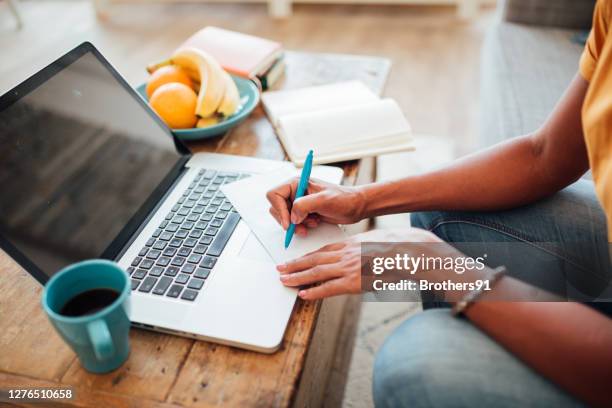 close up of an african american woman voting from home - voter registration stock pictures, royalty-free photos & images