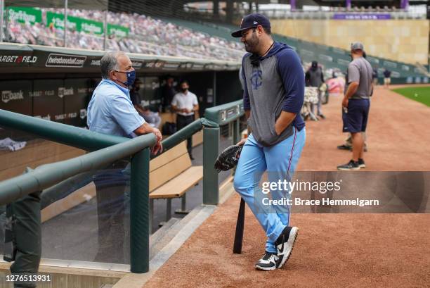 September 23: Alex Avila of the Minnesota Twins talks with general manager Al Avila of the Detroit Tigers on September 23, 2020 at Target Field in...