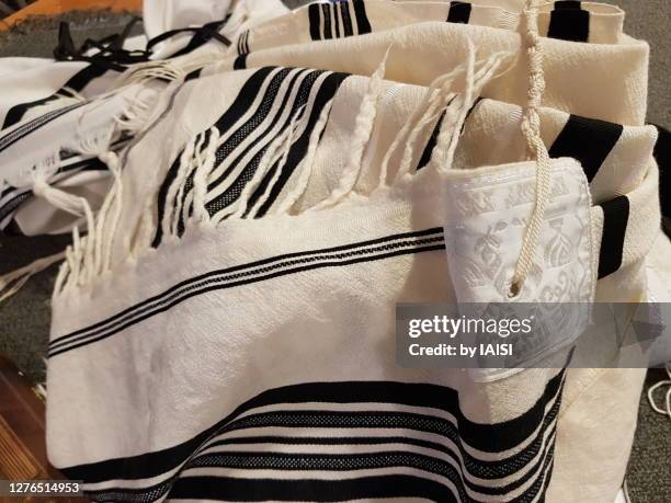 close-up of jewish prayer shawl / tallit, with black stripes according to the orthodox ashkenazic tradition - jewish prayer shawl stock pictures, royalty-free photos & images