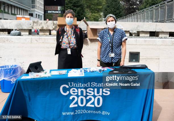 Census workers stand outside Lincoln Center for the Performing Arts as the city continues Phase 4 of re-opening following restrictions imposed to...