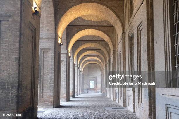 corridor with arches and columns of an ancient building without people - building atrium bildbanksfoton och bilder