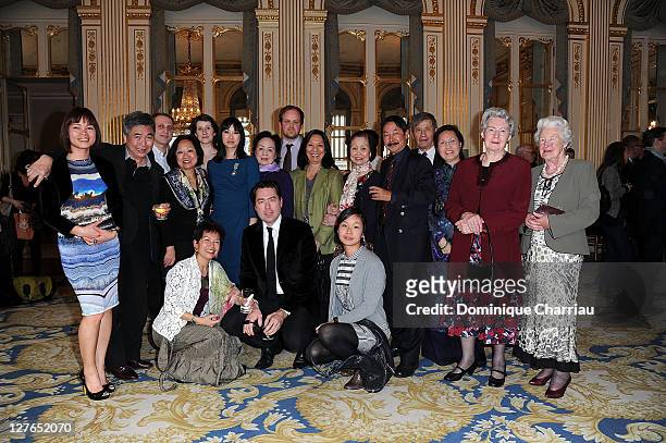 Linh-Dan Pham poses with her family after she receives the medal "Chevalier des Arts et lettre" at Ministere de la Culture on April 5, 2011 in Paris,...