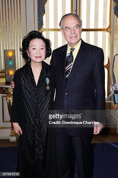 Yoon Jung-Hee and French Minister of Culture Frederic Mitterrand pose after she receives the medal "Chevalier des Arts et des lettres" at Ministere...
