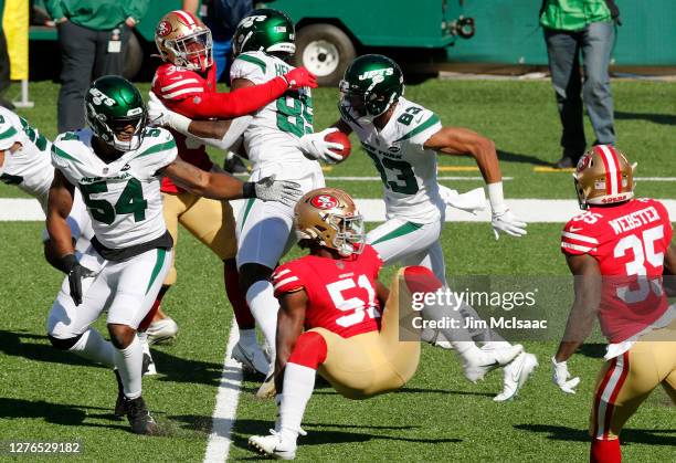 Josh Malone and Avery Williamson of the New York Jets in action against the San Francisco 49ers at MetLife Stadium on September 20, 2020 in East...