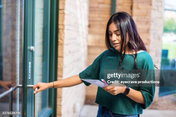 generation z hispanic female voter with mail-in voting election ballot in western usa photo series - voting covid stock pictures, royalty-free photos & images