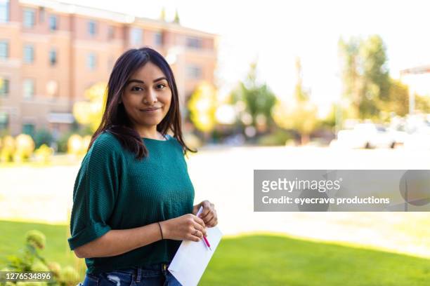 generation z hispanic female voter with mail-in voting election ballot in western usa photo series - voting by mail stock pictures, royalty-free photos & images