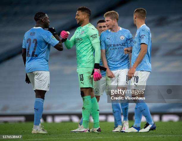 Manchester City players Benjamin Mendy, Zack Steffen, Kevin De Bruyne, Phil Foden and Taylor Harwood-Bellis congrtatulate each other at the final...
