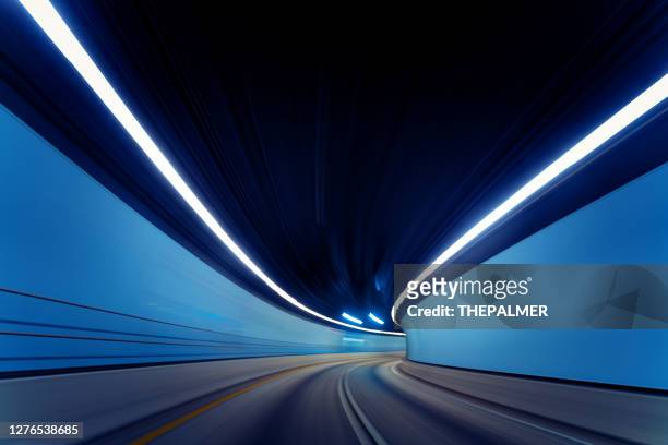 driving on empty traffic tunnel during pandemic 2020 - digital highway stock pictures, royalty-free photos & images
