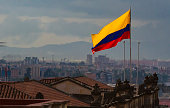 Colombian flag with view of down town Bogota