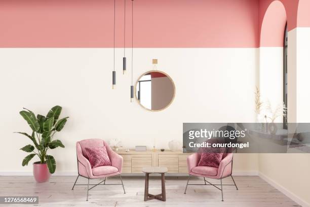 roze fauteuils in de woonkamer met salontafel, hanglampen, plant- en parketvloer - pink color stockfoto's en -beelden
