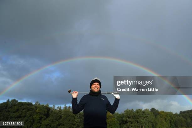 David Drysdale of Scotland poses for a photograph as a rainbow appears during Day Two of the Dubai Duty Free Irish Open at Galgorm Spa & Golf Resort...